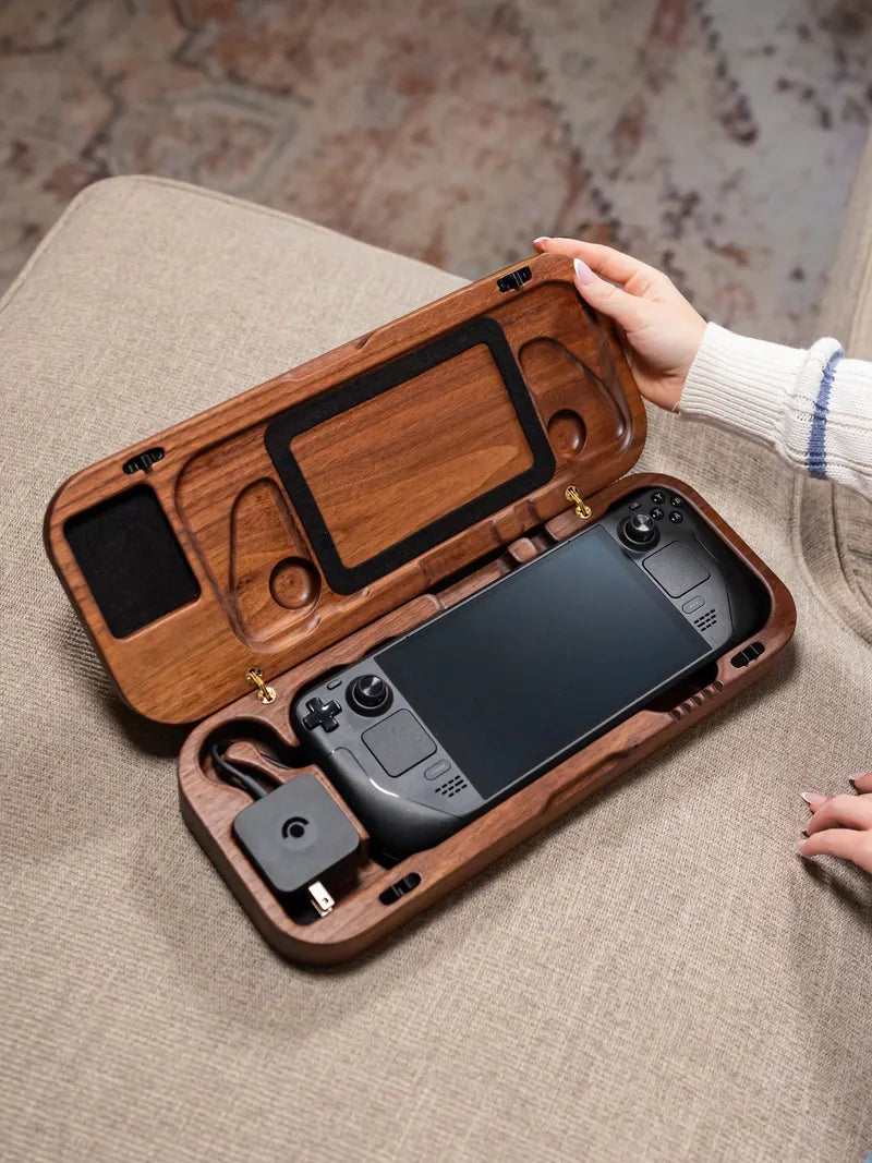 Walnut wooden travel case for a steam deck on a textured surface