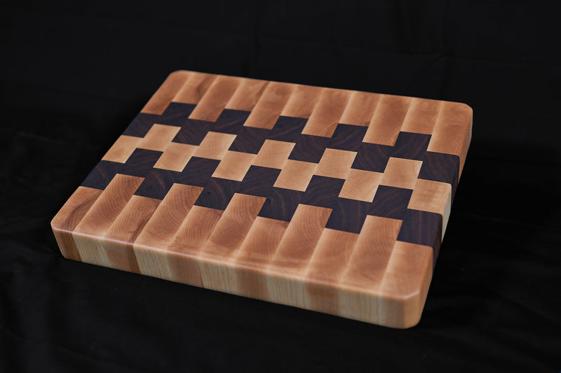 Black walnut and hard maple end grain butcher block, 17x13 inches, handcrafted by Kineo Mountain Woodsmithing.