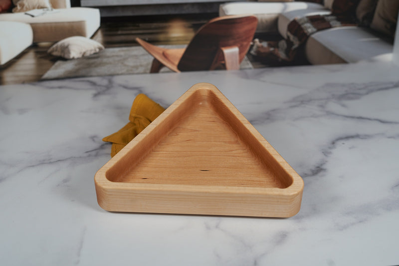 Kineo Mountain Woodsmithing hard maple catchall tray in a triangle shape, measuring 9.75x8.5 inches, with a smooth finish.