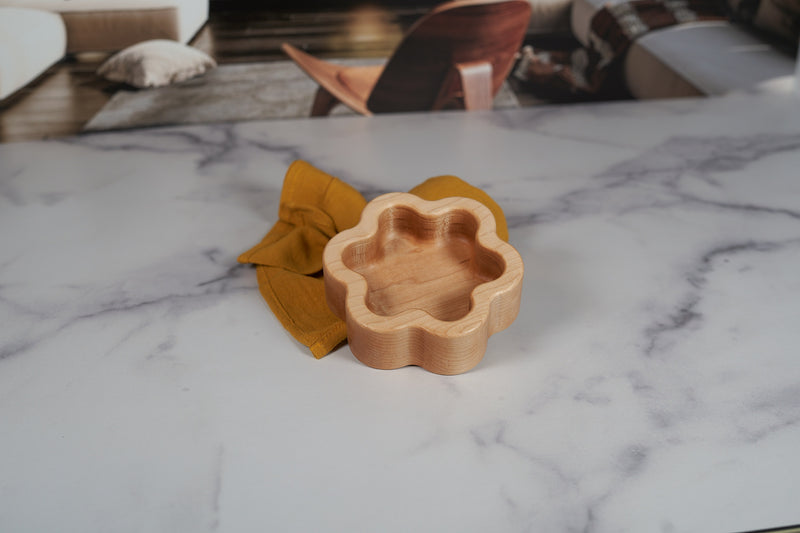Kineo Mountain Woodsmithing hard maple catchall tray with six-point star design, measuring 5 by 4.5 inches, natural wood finish.