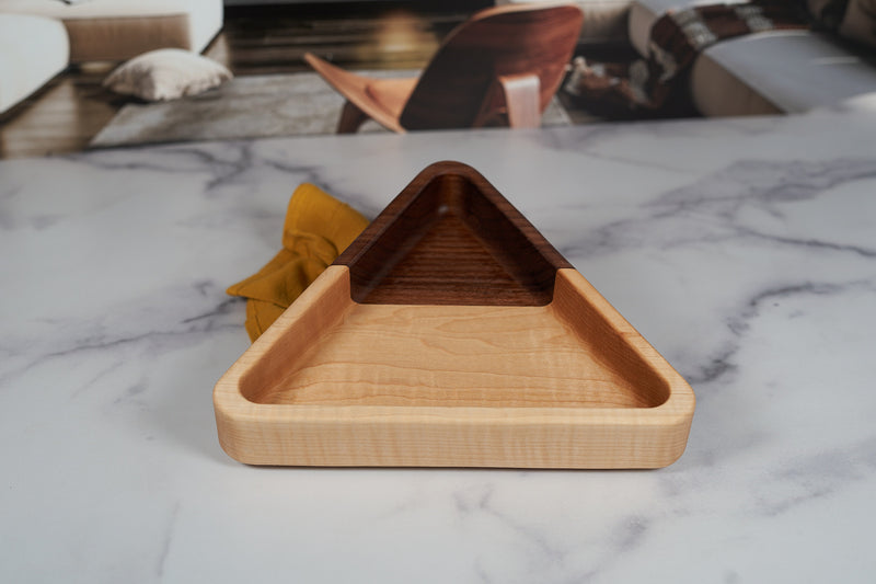 Black Walnut and Maple catchall tray by Kineo Mountain Woodsmithing, triangle-shaped, 9.75x8.5 inches, showcasing wood grain details.