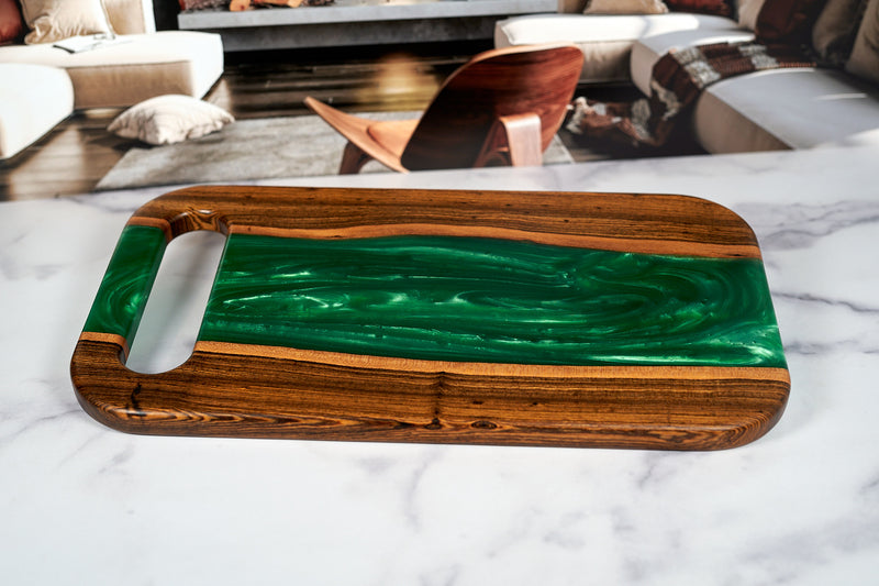 Bocote River charcuterie board by Kineo Mountain Woodsmithing, 18 x 10 inches, showcasing rich wood grain and craftsmanship.