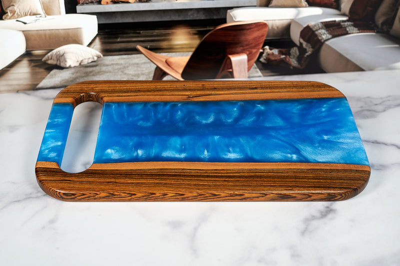 Bocote River Charcuterie Board by Kineo Mountain Woodsmithing, 18x10 inches, featuring rich wood grain and smooth surface for serving.