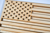 Wooden American flag wall art by Kineo Mountain Woodsmithing, featuring rustic wooden stars and stripes for home decor.