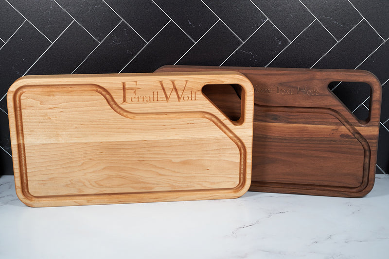 Custom Pyramid Peak cutting board by Kineo Mountain Woodsmithing, showing a detailed wooden design with smooth edges.