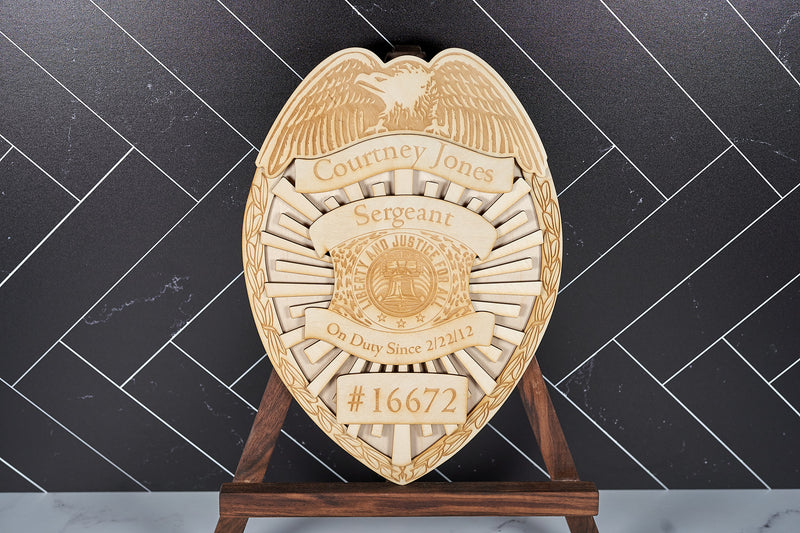 Law enforcement wooden commemorative wall art decor by Kineo Mountain Woodsmithing, featuring engraved police badge design.