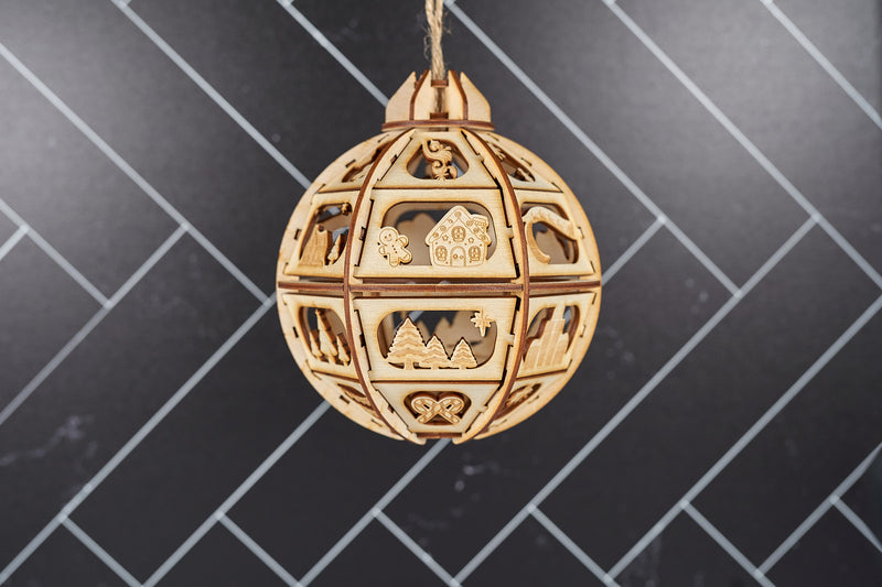 Decorative wooden Christmas ornament in 2024 design by Kineo Mountain Woodsmithing, featuring a rustic holiday style.