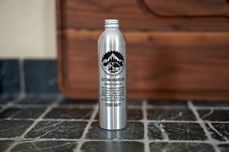 Kineo Mountain Woodsmithing Cutting Board Oil 8oz bottle, natural wood finish, designed for nourishing and protecting cutting boards.