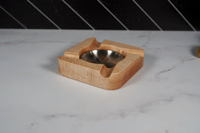 Kineo Mountain Woodsmithing Eagle River Cigar Rest with carved eagle design, made from polished wood for cigar placement.