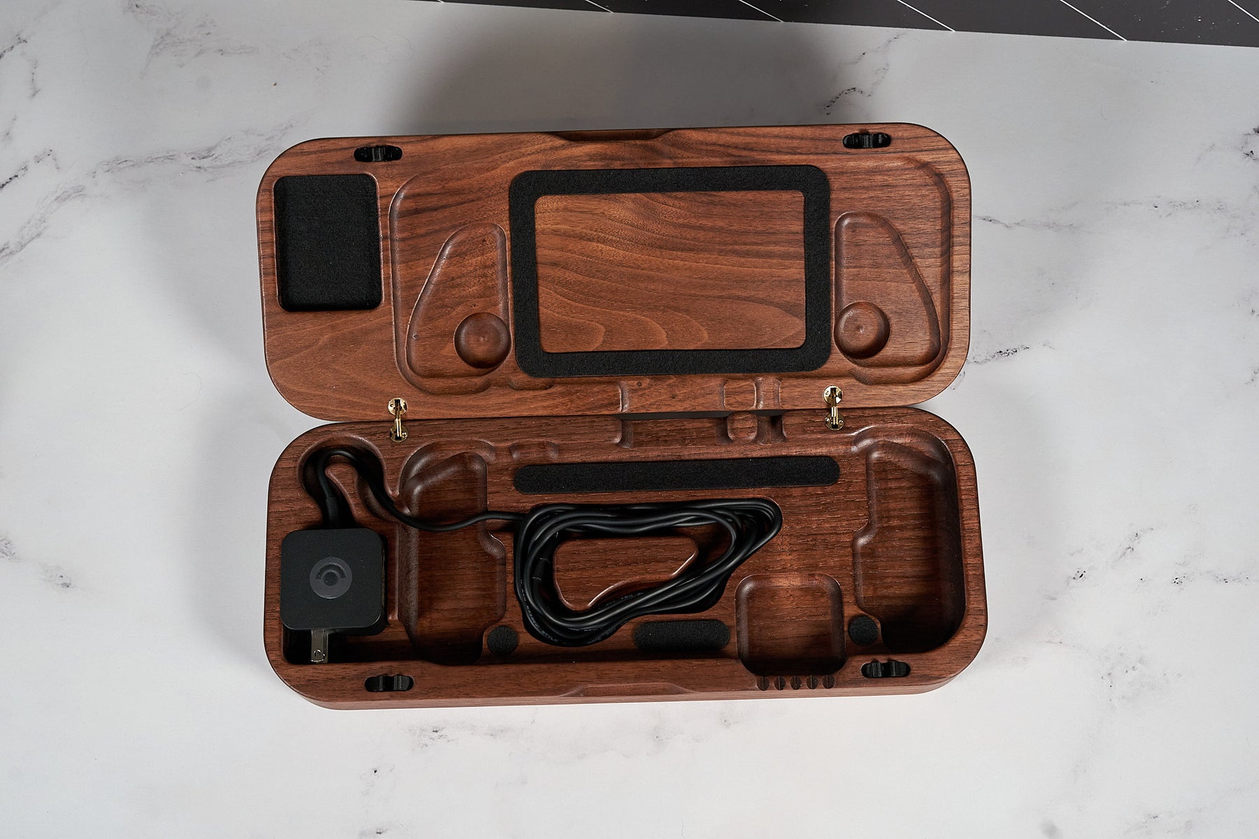 Kineo Mountain Woodsmithing travel gaming case with wood finish and secure latch, designed for portable gaming gear.