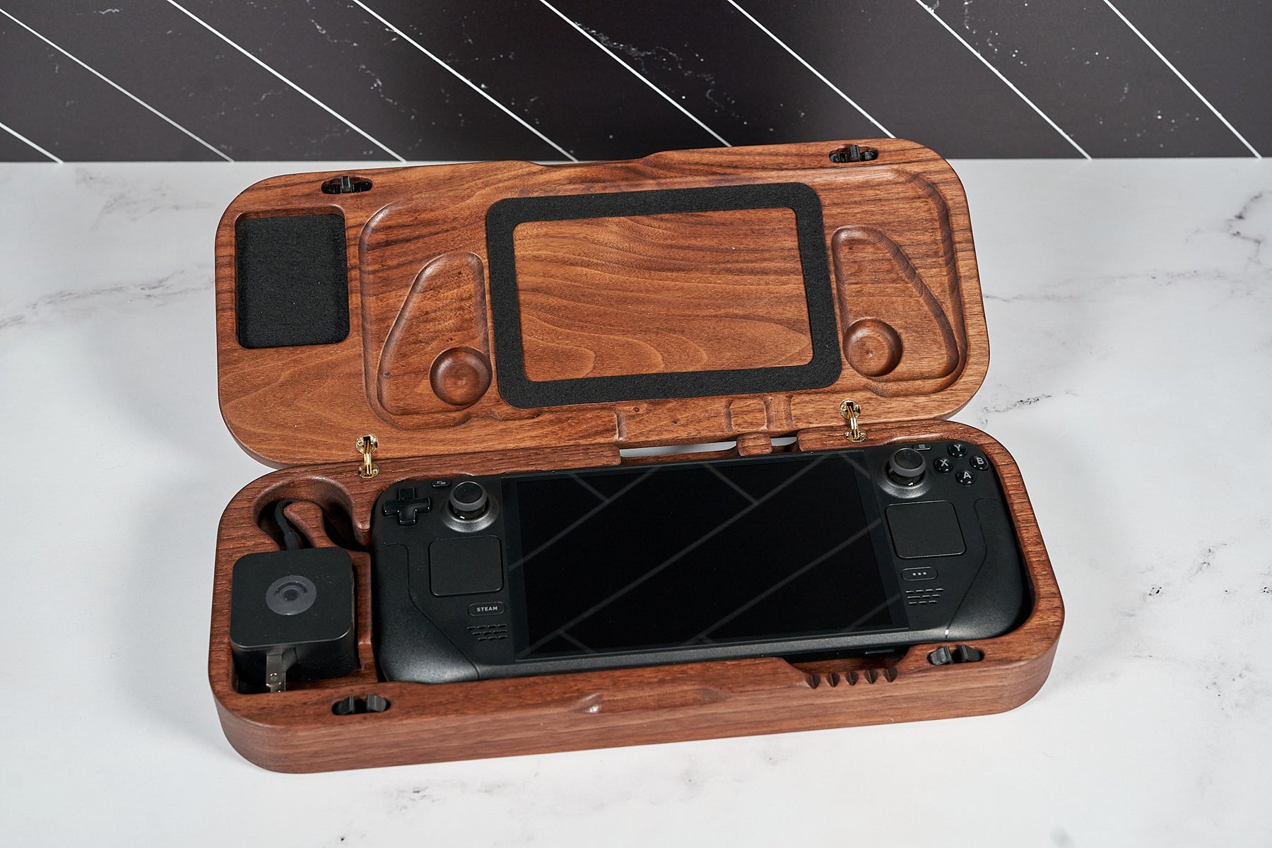 Kineo Mountain Woodsmithing travel gaming case open with gaming accessories inside, durable wooden exterior and secure latch.