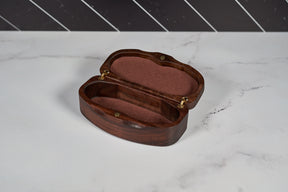 Kineo Mountain Woodsmithing sunglasses case made of wood, with a natural finish, designed to protect and store sunglasses.