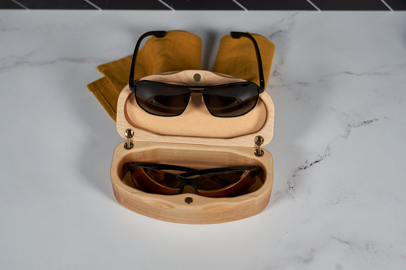 Kineo Mountain Woodsmithing sunglasses case made of wood with a smooth finish, designed to protect eyewear.