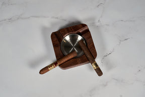Kineo Mountain Woodsmithing Eagle River Cigar Rest made of polished wood with carved eagle design for cigar holding.
