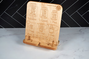 Kineo Mountain Woodsmithing Capitol Peak Cookbook Stand 2.0, wooden kitchen accessory with adjustable arms for holding cookbooks.