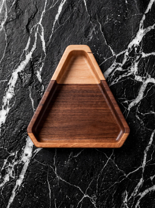 Handmade chamfered triangle wood valet tray in walnut, maple and cherry.