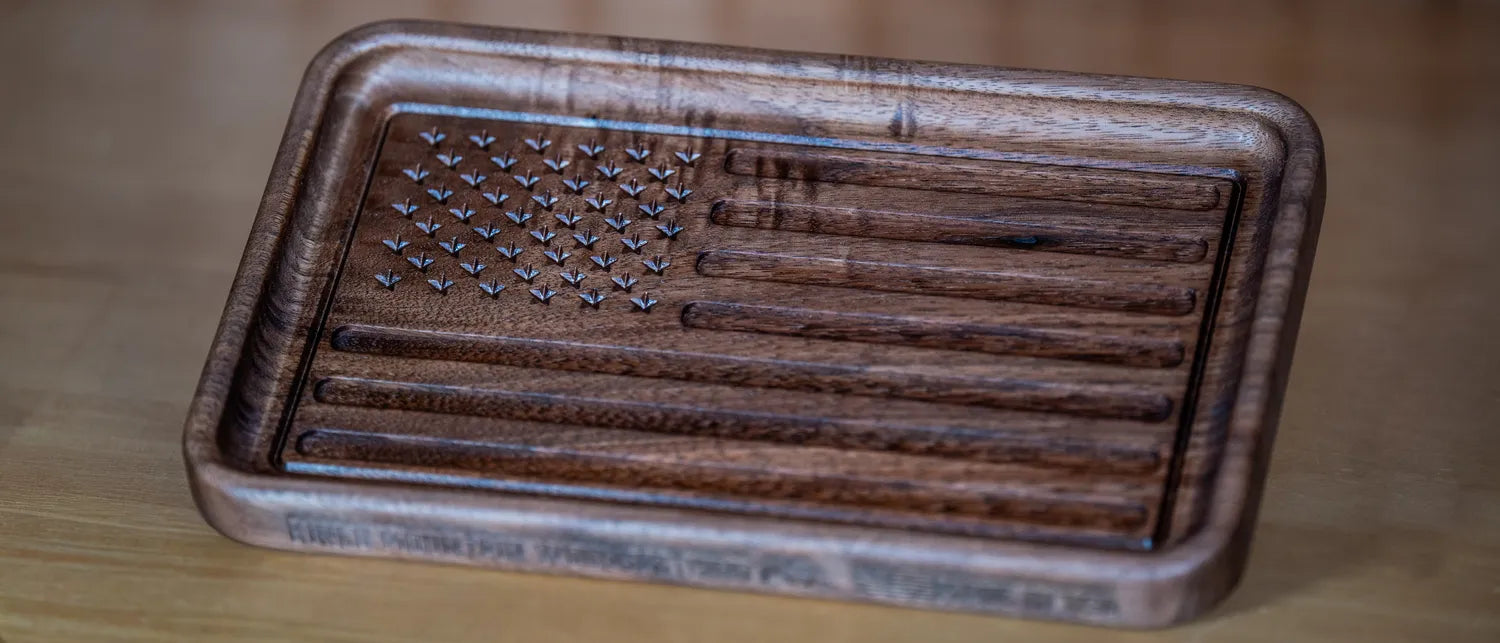 Walnut American flag catchall tray with the flag carved into its floor.