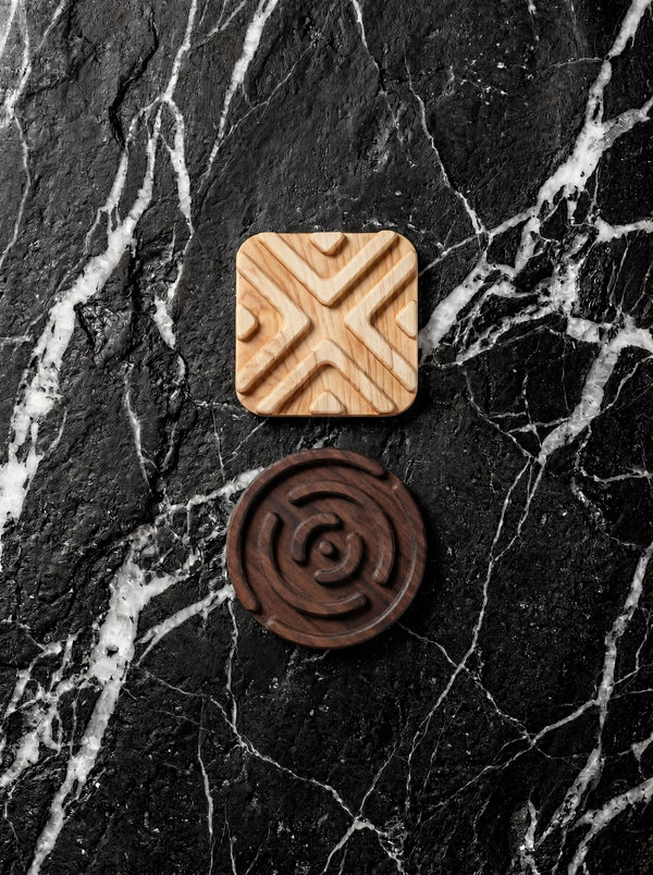 Handmade wooden trivets for hot pots in hard maple and walnut.